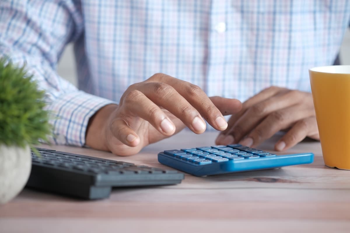 Person reviewing financial data at a small business accounting desk